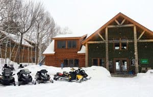 Katahdin lodge with snowmobiles