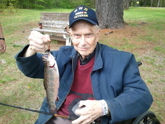 George's Dad, Ezra Smith, proudly shows off his brookie. 