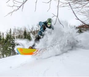 Snowboarder enjoying fresh snow. Click on the image above for more Maine winter photos - Click on the image above to access more Maine winter images.